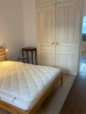 Un ou plusieurs lits dans un hébergement de l'établissement JAZZ - Appart original 5pers rdch arrière cour calme, patio