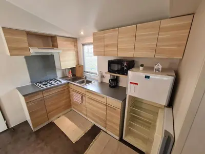 Cuisine ou kitchenette dans l'établissement Cute house in Alsace