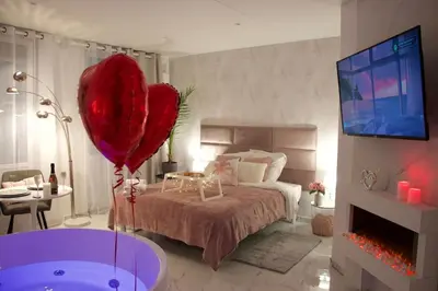 Un ou plusieurs lits dans un hébergement de l'établissement SPA Romantique ... Esprit LOVE