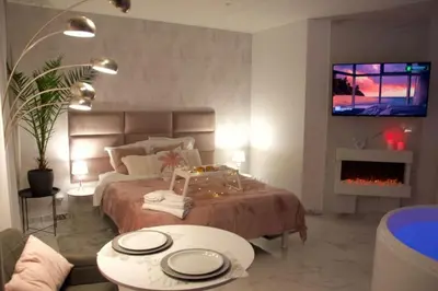 Un ou plusieurs lits dans un hébergement de l'établissement SPA Romantique ... Esprit LOVE