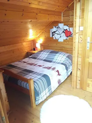 Un ou plusieurs lits dans un hébergement de l'établissement chalet La Vallée