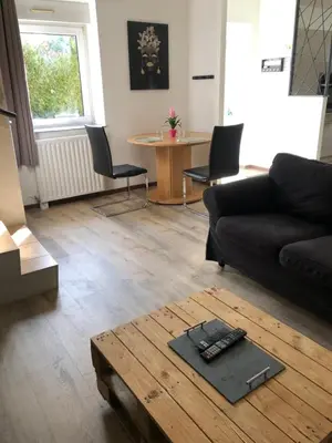 Coin salon dans l'établissement Appartement avec terrasse 6 personnes PAS DE FETE