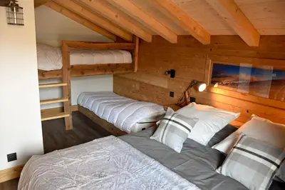 Un ou plusieurs lits dans un hébergement de l'établissement Le Chalet Margaux La Bresse