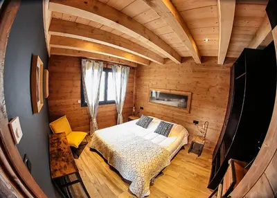 Un ou plusieurs lits dans un hébergement de l'établissement Le Chalet Margaux La Bresse