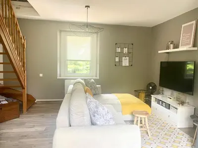 Télévision ou salle de divertissement dans l'établissement Superbe appartement duplex à Kaysersberg en Alsace