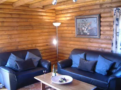 Coin salon dans l'établissement Le Chalet des Vosges