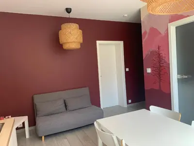 Coin salon dans l'établissement Au Paradis de la Rivière Joyeuse - Gite avec Terrasse