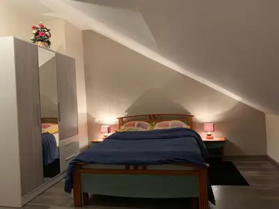 Un ou plusieurs lits dans un hébergement de l'établissement Rochire Location 1