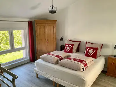 Un ou plusieurs lits dans un hébergement de l'établissement Gite Au sauna de l’Aubach