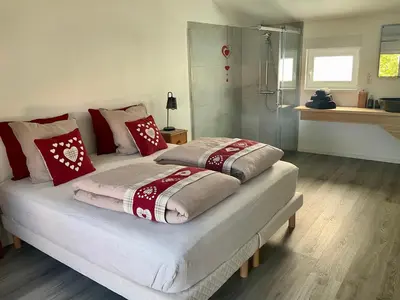 Un ou plusieurs lits dans un hébergement de l'établissement Gite Au sauna de l’Aubach