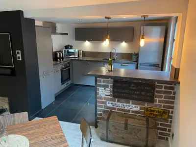 Cuisine ou kitchenette dans l'établissement Appartement chaleureux avec place de parking