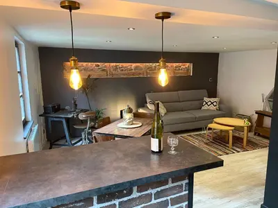 Coin salon dans l'établissement Appartement chaleureux avec place de parking