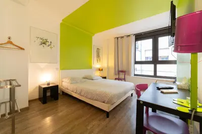 Un ou plusieurs lits dans un hébergement de l'établissement Maison Mondrian