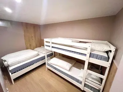 Un ou plusieurs lits dans un hébergement de l'établissement Ma Montagne Chic 3
