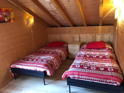 Un ou plusieurs lits dans un hébergement de l'établissement Chalet exposition plein sud