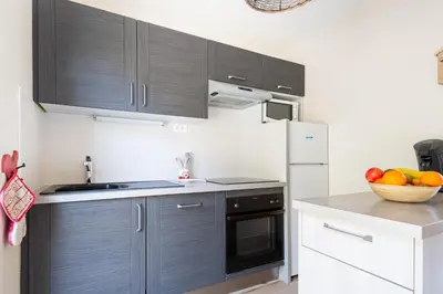 Cuisine ou kitchenette dans l'établissement Le Repère Des Marmottes