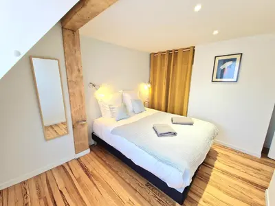 Un ou plusieurs lits dans un hébergement de l'établissement Home La Petite Porte - Petite Venise - Colmar