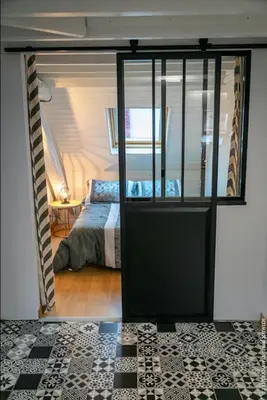 Un ou plusieurs lits dans un hébergement de l'établissement Appartement Les Tournesols avec Climatisation