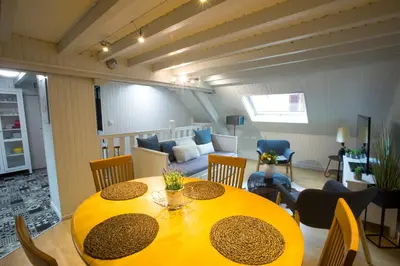 Coin salon dans l'établissement Appartement Les Tournesols avec Climatisation