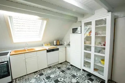 Cuisine ou kitchenette dans l'établissement Appartement Les Tournesols avec Climatisation