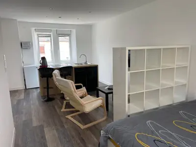 Un ou plusieurs lits dans un hébergement de l'établissement Le 33 L’Idéal