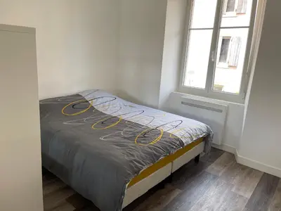 Un ou plusieurs lits dans un hébergement de l'établissement Le 33 L’Idéal