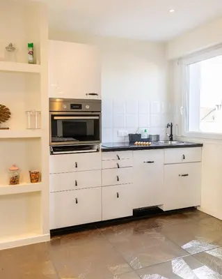 Cuisine ou kitchenette dans l'établissement Le Havre by Leslodgespa - Confort et élégance, terrasse privée, proche de l'aéroport et de Bâle