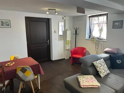 Coin salon dans l'établissement Le Nid Alsacien - Appartement cosy & lumineux à 10min de Colmar