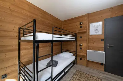Un ou plusieurs lits dans un hébergement de l'établissement Chalet du Bien-être 15p. Piscine,Spa, Hammam,Pétanque,Basket