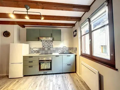 Cuisine ou kitchenette dans l'établissement Aux Deux Tours