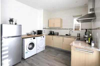 Cuisine ou kitchenette dans l'établissement L'instant T 4* Balnéo, Sauna et Parking Privé