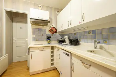 Cuisine ou kitchenette dans l'établissement Le Montagnard