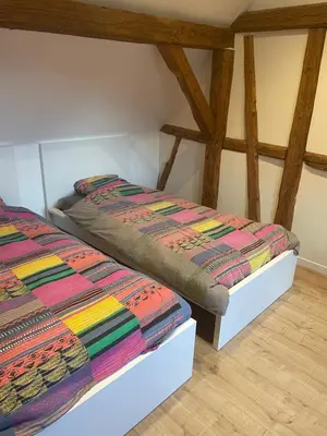 Un ou plusieurs lits dans un hébergement de l'établissement Gîte Elisa et léna