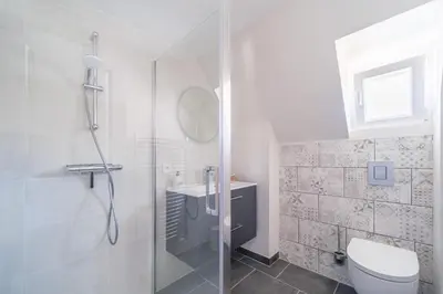 Salle de bains dans l'établissement Le Coteau de Sigo