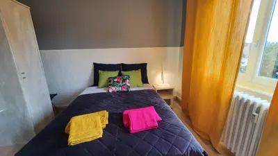 Un ou plusieurs lits dans un hébergement de l'établissement Le Bienvenue à Colmar - Parking Privé Inclus, Centre à Deux Pas