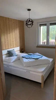 Un ou plusieurs lits dans un hébergement de l'établissement Appartement Le Grand Duc