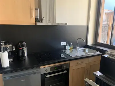 Cuisine ou kitchenette dans l'établissement la grange à Emile