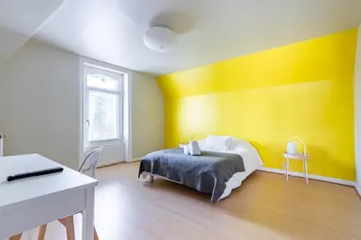 Un ou plusieurs lits dans un hébergement de l'établissement Les Libellules - Maison de caractère 5ch