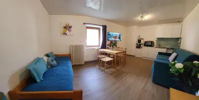 Coin salon dans l'établissement Gite Bruyère, 2 à 5 personnes avec salle de jeux et SPA dans la résidence