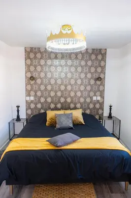 Un ou plusieurs lits dans un hébergement de l'établissement Appartement de la noblesse - designed by C.M