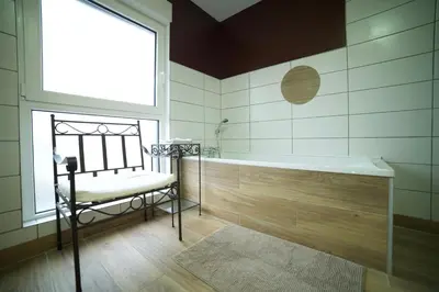 Un ou plusieurs lits dans un hébergement de l'établissement B&B Chambre cosy avec petit-déjeuner inclus Parking prive & box vélo sur la Route des vins