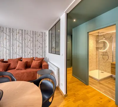 Coin salon dans l'établissement Appartement Le Verdoyant hyper centre avec Parking et Sauna