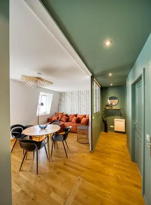 Coin salon dans l'établissement Appartement Le Verdoyant hyper centre avec Parking et Sauna