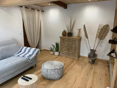 Coin salon dans l'établissement Chalet « à l’orée du bois »