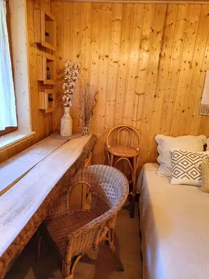 Un ou plusieurs lits dans un hébergement de l'établissement Chalet « à l’orée du bois »