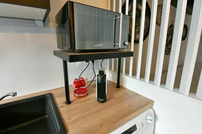 Cuisine ou kitchenette dans l'établissement Au Fil du Temps