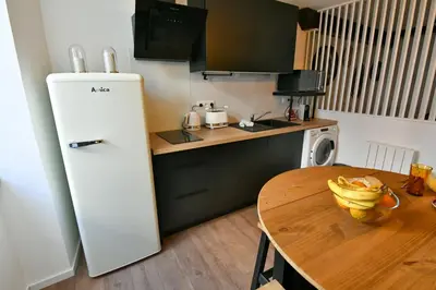 Cuisine ou kitchenette dans l'établissement Au Fil du Temps