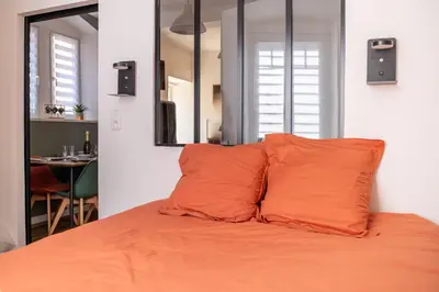 Un ou plusieurs lits dans un hébergement de l'établissement Appartement Cosy avec Jardin au Centre Historique de Sélestat & Proche Europa-Park