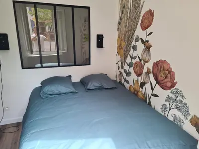 Un ou plusieurs lits dans un hébergement de l'établissement Appartement Cosy avec Jardin au Centre Historique de Sélestat & Proche Europa-Park