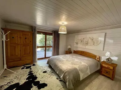 Un ou plusieurs lits dans un hébergement de l'établissement Chalet Kelly, centre ville / Jacuzzi / Sauna